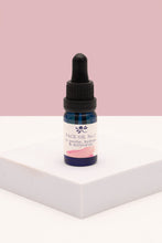 Load image into Gallery viewer, Bottle of Face Oil No3 from Soap Matters on a white surface with a pink background