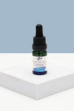 Load image into Gallery viewer, Bottle of Face Oil No. 2 on a white surface with a light blue background from Soap Matters